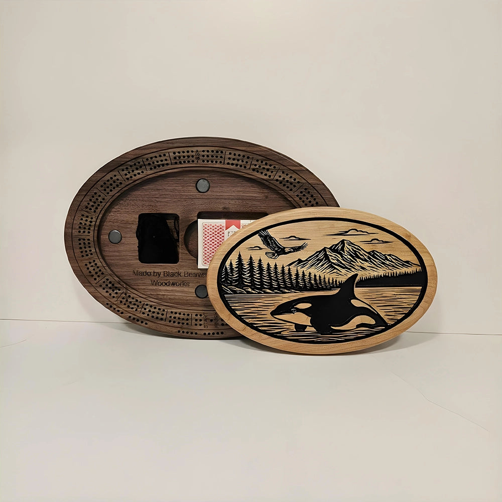 Handcrafted Orca and Eagle Cribbage Board  Custom-Engraved Wooden Game featuring integrated card storage.